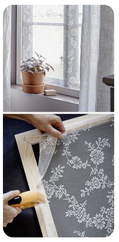 a person is cutting fabric with a pair of scissors on the window sill next to a potted plant