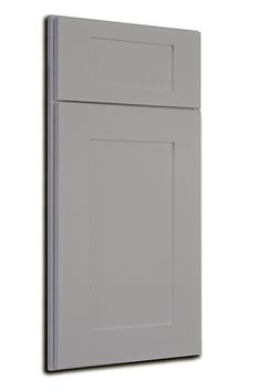 a gray cabinet door on a white wall