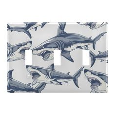 a light switch cover with sharks on it