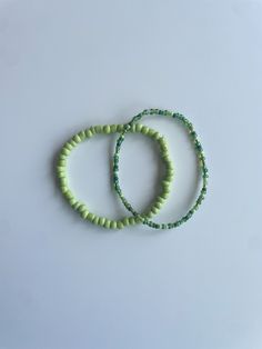 Stretchy bracelet set (2) - lime green medium sized bracelet, multi-green seed bead bracelet These bracelets come in a set of two. They are meticulously handmade with seed beads and stretchy string. The durable bracelets are all triple knotted and glued shut. DISCLAIMER ON RETURN/EXCHANGE POLICY ~ Slightly mis-shaped bracelets due to knotting of the stretchy string is NOT INCLUDED in the return/exchange policy ~ Stretched out bracelets due to use over time is NOT INCLUDED in the return/exchange policy ~ Only broken beads or broken string within the return/exchange policy window ARE INCLUDED in the return/exchange policy Green Beaded Bracelets, Seed Bead Bracelet, Stretchy Bracelets, Seed Bead Bracelets, Bead Bracelet, Seed Bead, Bracelet Set, Beaded Bracelet, Arm Band