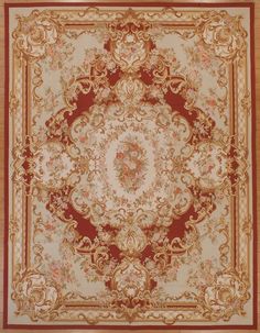 an ornate rug with red and gold accents