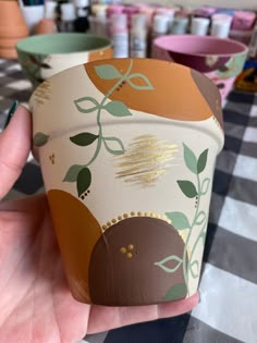 Art work by @hervividroots Pottery Painting Ideas Flower Pot, Pot Diy Painted, Painting A Pot Ideas, Paint Pots Diy, Taylor Swift Plant Pot, Boho Flower Pot Painting, Succulent Pot Painting Ideas, Diy Painting Pots