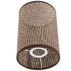 a brown and white lamp shade with a circle on the bottom, in front of a white background