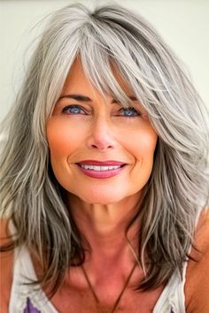 Textured Gray Layers With Bangs Haircut on smiling woman with gray hair. Medium Silver Hairstyles, Medium Length Gray Hair With Layers, Feathered Bangs Medium Hair, Grey Shag Hairstyles, Medium Grey Hair, Layered Hair Medium With Bangs, Medium Length Grey Hair, Medium Length Layered Hair With Bangs, Face Framing Layers Medium Length Hair