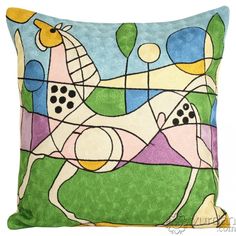 a decorative pillow with a horse painted on it