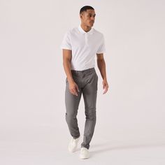 "Introducing our versatile Regular Fit Stretch Chino Trouser in a stylish shade of grey! Crafted with both comfort and style in mind, these trousers are designed to fit you perfectly. The regular fit provides a relaxed yet polished look, while the stretch fabric ensures easy movement throughout the day. Whether you're heading to the office or a casual weekend outing, these chinos are your go-to choice. With their timeless color, they can be effortlessly paired with any outfit to elevate your style. Upgrade your wardrobe with these grey chinos that combine a comfortable fit with a touch of sophistication. Product Features: Grey Stretch Fabric Regular Chino fit Tonal buttons Welt pockets to back 98% cotton 2% spandex Our Model is 5'11\" and wears size 32. To find the perfect fit for yourself Grey Pants Outfit Men, Grey Chinos Men, Trousers Outfit Men, Grey Chino, Grey Pants Outfit, Grey Chino Pants, Mens Business Casual Outfits, Slim Fit Chino Pants, Fabric Pants