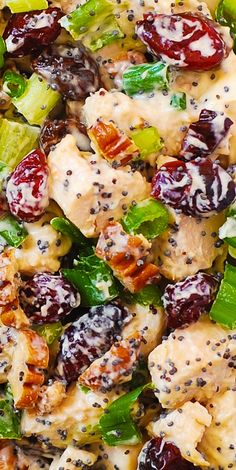 a salad with chicken, lettuce and cranberries