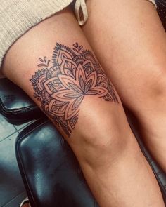 a woman's legs with a tattoo on them