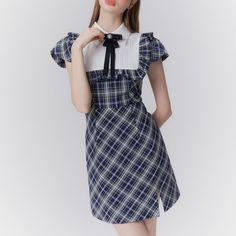 A classic dress that will make you look like a sophisticated literary girl. She is fascinated by the dark navy plaid pattern. Frills are decorated from her shoulders to her chest. An item that combines quality and cuteness. 
 
 
 Size 
 
 
 
 
 S size 
 
 Length: 84cm 
 Shoulder width: 34cm 
 Bust: 86cm 
 Waist: 66cm 
 
 M size 
 
 
 Length: 85.5cm 
 Shoulder width: 35cm 
 Bust: 90cm 
 Waist: 70cm 
 
 L size 
 
 Length: 87cm 
 Shoulder width: 36cm 
 Bust: 94cm 
 Waist: 74cm 
 
 
 
 
 
 
 
 
 Mat Plaid Short Sleeve Dress For School, Elegant Plaid Mini Dress, Elegant Plaid Dresses With Ruffles, Elegant Mini-length Plaid Dress, Elegant Mini Length Plaid Dress, Elegant Gingham Mini Dress, Classic Dress, Plaid Pattern, Dark Navy