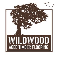 the logo for wildwood aged timber flooring, with an image of a tree