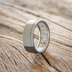 a wedding ring with white sand in it