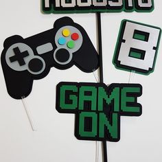 a cake topper that has some video game controllers on it