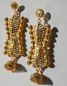 These unique treasures, crafted from brass and plated in radiant 24K gold, showcase the jewelry style found in Senegal. Embrace the beauty of heritage with this piece, connecting you to the soulful charm of Senegal's vibrant markets. 24K Plating over brass 5.25in Length 22k Gold Plug Earrings For Wedding, Wedding 22k Gold Plug Earrings, Temple Jewelry Style Bridal Drop Earrings In 22k Gold, Temple Jewelry Bridal Drop Earrings In 22k Gold, Temple Style 22k Gold Bridal Drop Earrings, Festive 22k Gold Drop Earrings, Wedding 22k Gold Danglers, 22k Gold Latkan Earrings For Celebrations, Yellow Gold Plated Plug Earrings For Wedding