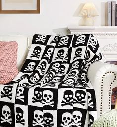 a black and white blanket with skulls on it