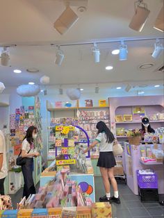 two girls are shopping in a toy store