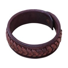 Designed by Thai artisan Khun Boom this striking bracelet circles the wrist with a wristband of dark brown leather. Khun Boom hand-weaves lighter brown leather strips around the exterior of the bracelet for a bold accessory. Adjustable Brown Leather Bracelet With Wrist Strap, Hand Tooled Adjustable Leather Bracelets, Adjustable Hand Tooled Brown Leather Bracelet, Adjustable Hand-tooled Brown Leather Bracelet, Adjustable Brown Cuff Bracelet With Bracelet Strap, Adjustable Brown Cuff Bracelet With Strap, Handmade Leather Braided Bracelet, Brown Leather Strap Bracelet, Adjustable Brown Wristband With Bracelet Strap