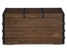 a wooden chest with metal straps on the top and bottom, sitting against a white background