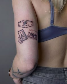 a woman with a tattoo on her arm