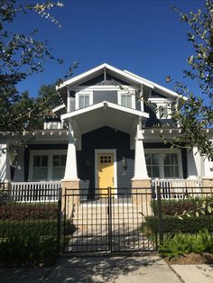 a house that has a gate in front of it