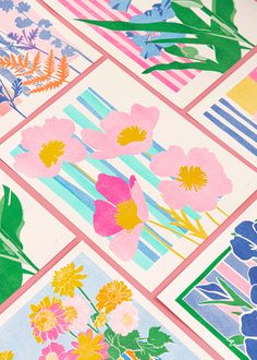 colorful flowers and leaves are arranged on different colored paper squares with stripes in the background