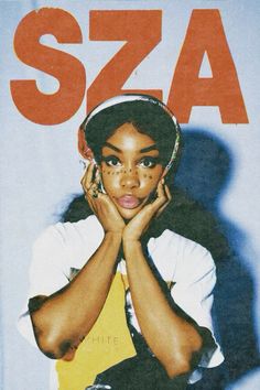 a woman sitting on top of a magazine cover with her hands under her chin and head