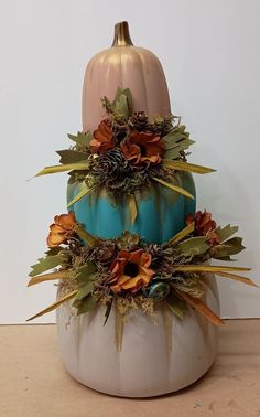 a blue and white pumpkin sitting on top of a table