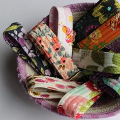 a bunch of fabric ties in a bowl