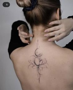 a woman with a tattoo on her back