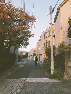 a person walking down the middle of an empty street