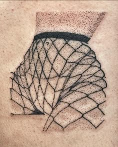 an abstract tattoo design on the back of a woman's shoulder, with lines and dots