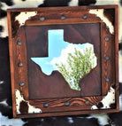 the texas state is made out of wood and has an image of a tree on it