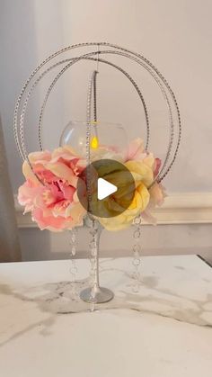 a vase with flowers in it sitting on top of a table