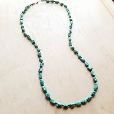 We've got heart eyes for this long turquoise necklace! This long boho necklace is made up of natural turquoise chunks and small wooden beads. This turquoise stone necklace is the perfect item to layer with shorter necklaces and boho statement necklace as shown in the attached pictures. Add this turquoise stone necklace to your unique handmade jewelry collection! Although your handmade beaded necklace will resemble the photo, each piece is created by hand, so no two are identical. Length: 38 inch Cheap Adjustable Turquoise Beaded Necklace, Turquoise Gemstone Long Beaded Necklace, Adjustable Turquoise Beaded Amazonite Necklaces, Bohemian Howlite Gemstone Beaded Necklaces, Bohemian Turquoise Amazonite Jewelry, Bohemian Howlite Beaded Necklace With Gemstone Beads, Long Turquoise Beaded Necklace For Festivals, Turquoise Beaded Long Necklace For Festivals, Turquoise Long Beaded Necklace