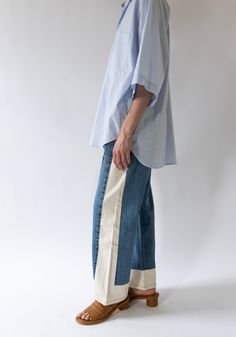 Vintage Reworked Slouch Jean in Indigo and Natural from B Sides. Made from a combination of reworked vintage jeans and natural cream side panels. Mid-rise with a slouchy fit, relaxed hip and wide leg. This style runs 1-2 sizes large, size down one size for the intended slouchy fit and 2 sizes for a more fitted look around the waist. These jeans have a longer inseam and can be worn slouchy, cuffed or you can cut for a raw edge finish like the Lasso. Re-made from authentic vintage Levi's 501's, co Sewing Projects Denim, Jeans With Side Panels, Add Fabric To Jeans, Make Jeans Longer, Artistic Fashion Style, Comme Des Garcons Aesthetic, Upsize Jeans, Vintage Clothing Aesthetic, Street Wear For Women