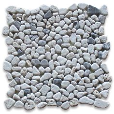 a bunch of white rocks sitting on top of each other in front of a white background