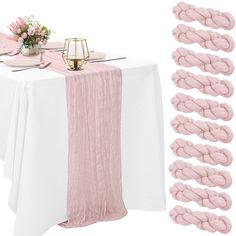 the table is set with pink napkins and place settings