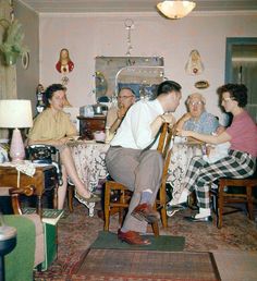 a group of people sitting around a dining room table