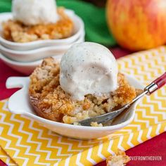 two bowls filled with apple crisp on top of a yellow and white napkin