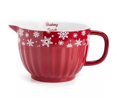 a red and white cup with snowflakes on it