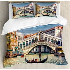 a bed with two pillows on it and a painting of a gondola in venice