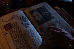 an open book sitting on top of a wooden table