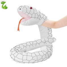 an inflatable snake is being held by a person's arm and head