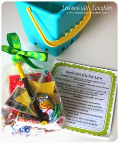 the contents of a survival kit for life sitting on a table next to a blue container