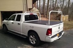 a white truck parked in front of a house