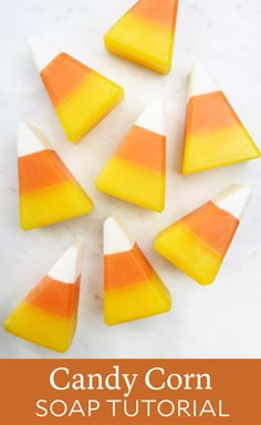 orange and white candy corn on a marble surface