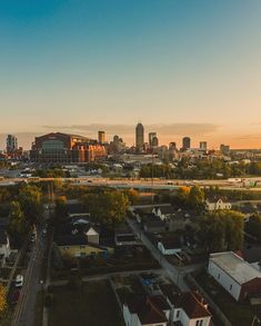 an aerial view of a city at sunset