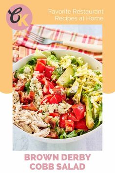 brown derby cobb salad with chicken and avocado in a white bowl on a red checkered table cloth