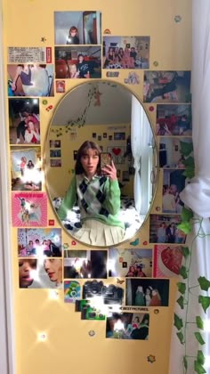 a woman taking a selfie in front of a mirror with many photos on it