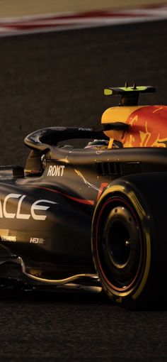 a red bull racing car driving on a race track