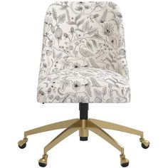 a white and gold office chair with an upholstered floral pattern on the back